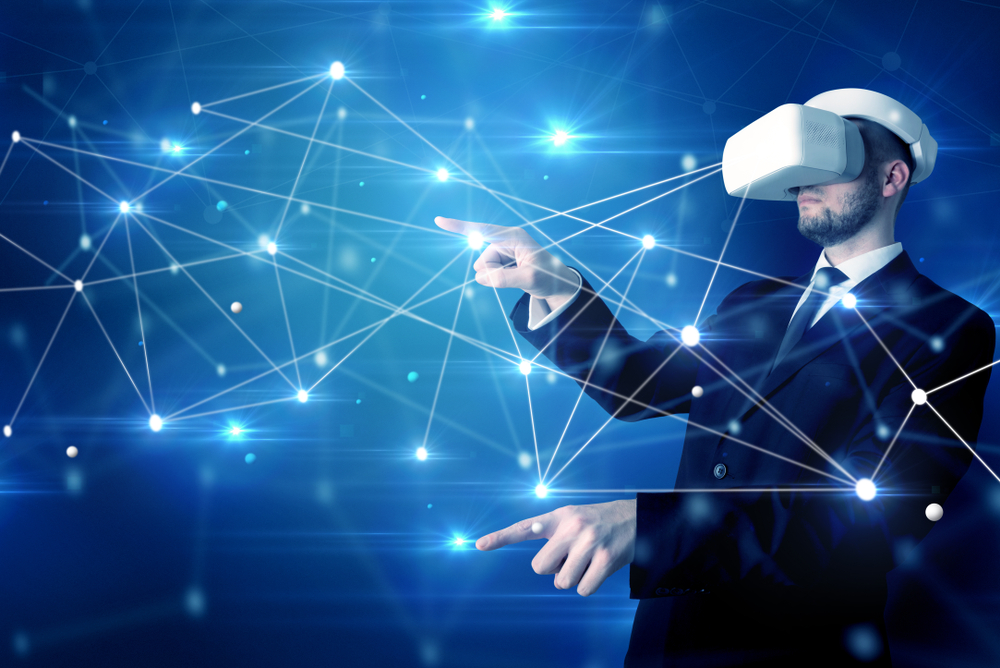 Businessman in virtual reality goggles investigate global network connectivity concept